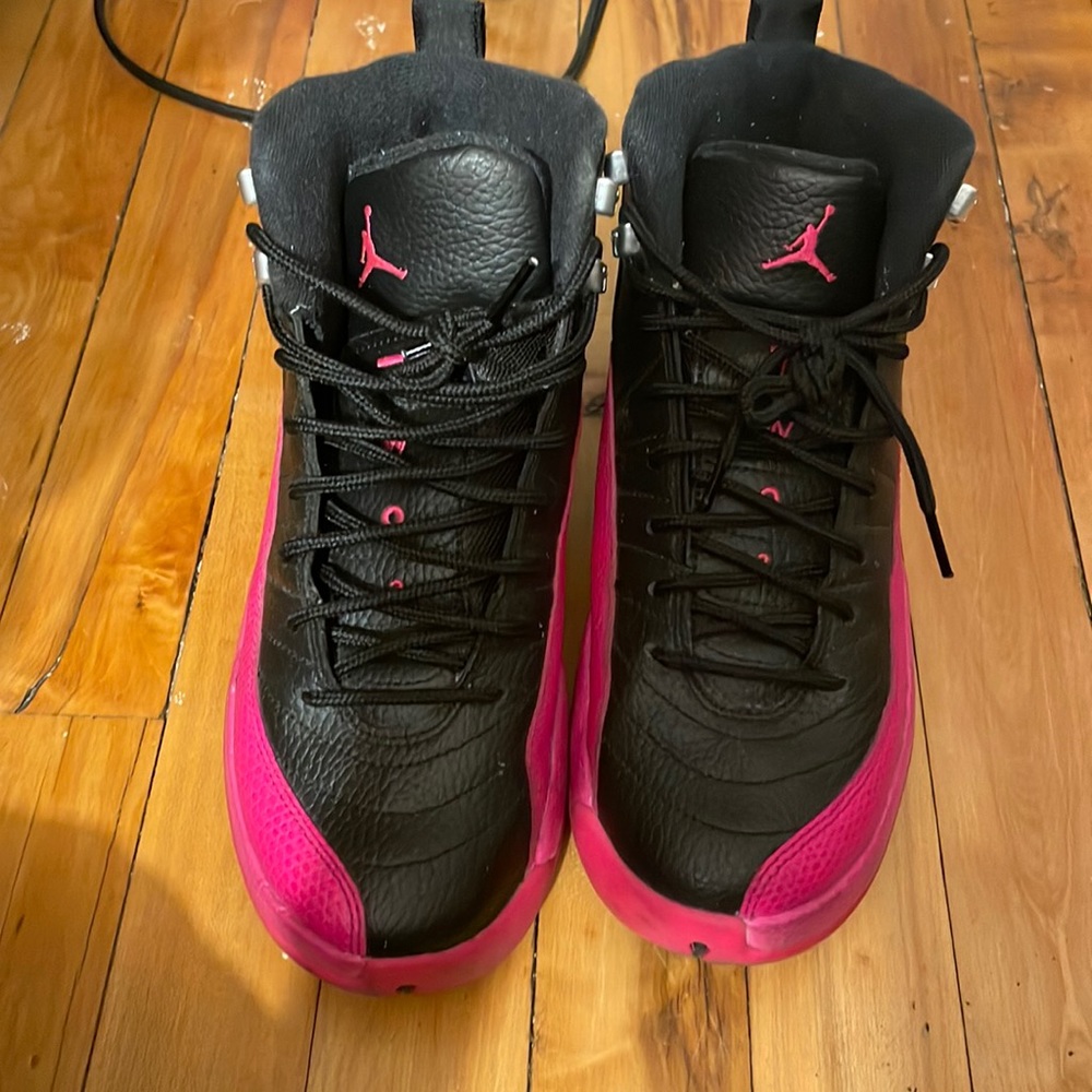 Pink and black air jordan 12s